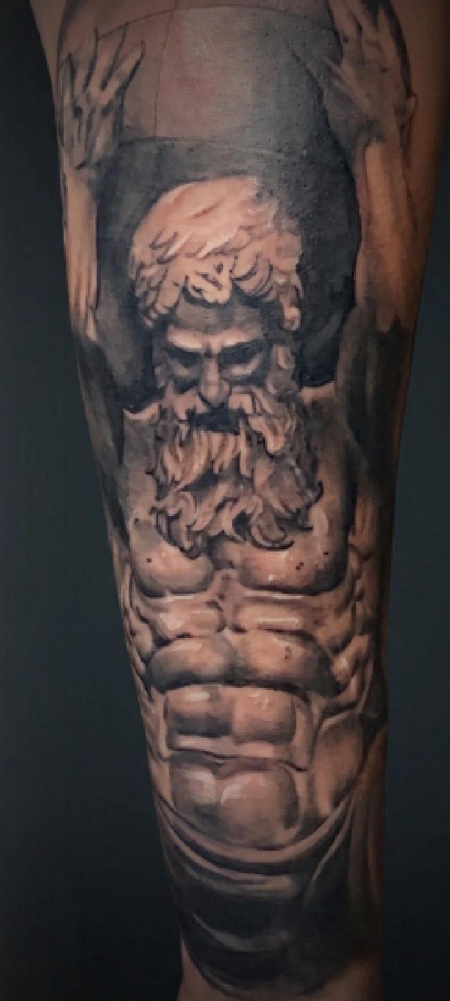 Atlas black-and-grey realism tattoo by Cheeser at Dandyland
