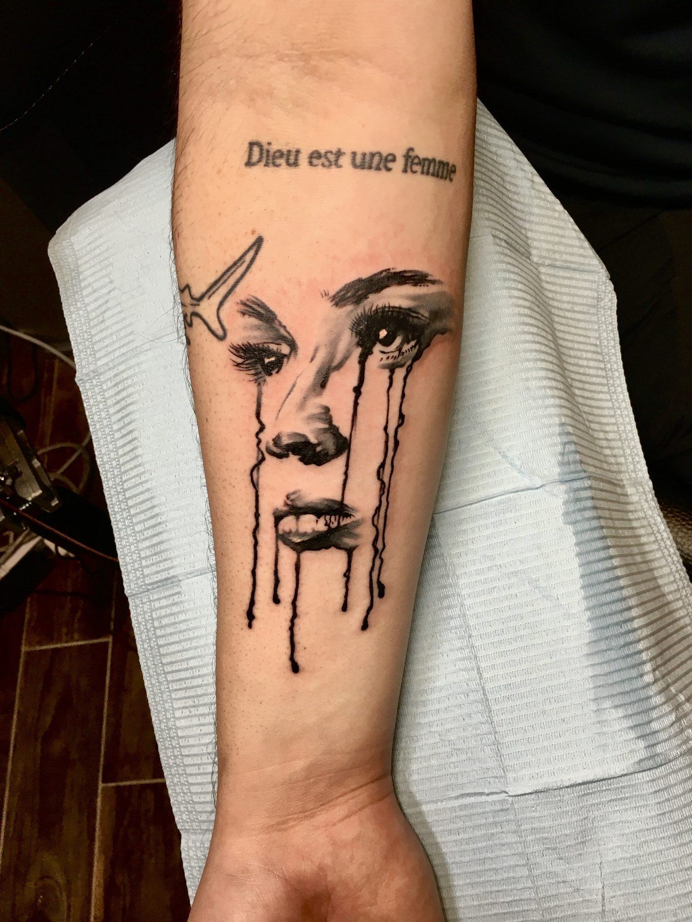 Fine-line blackwork forearm tattoo