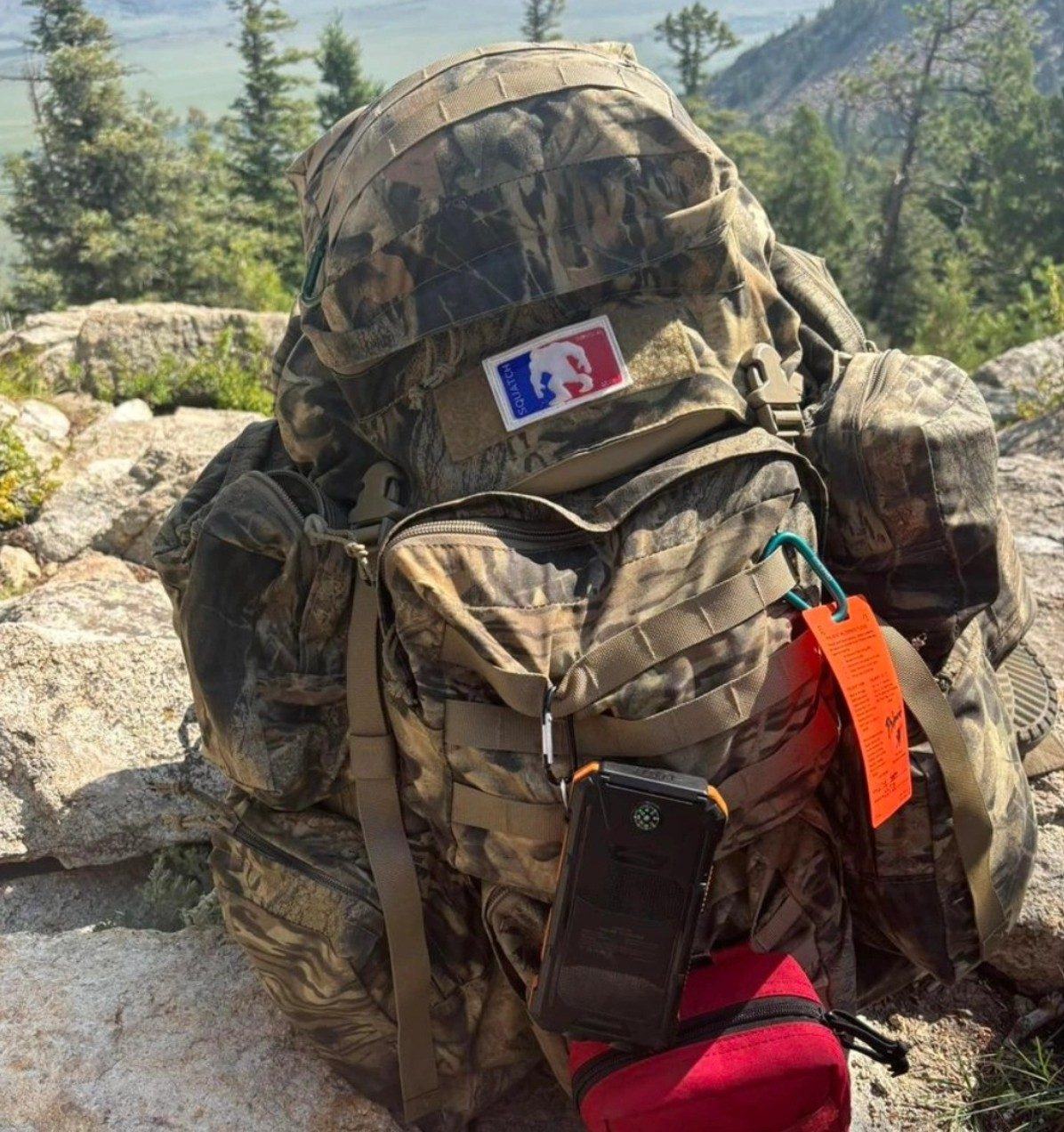Squatch Survival Gear pack in pine forest