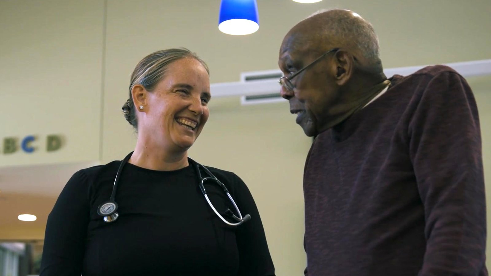 A nurse and a resident at a Washington State Veterans Home
